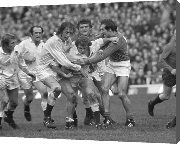 Englands Tony Neary and Chris Ralston battle with France - 1975 Five Nations