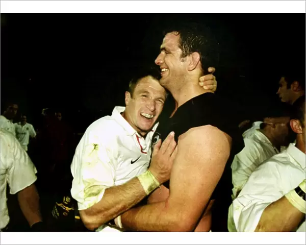 Martin Johnson and Mike Catt celebrate after beating South Africa in 2000