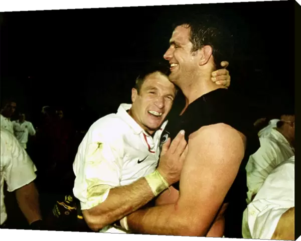 Martin Johnson and Mike Catt celebrate after beating South Africa in 2000