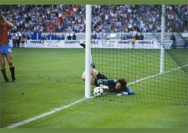 Spain goalkeeper Luis Arconada fumbles the ball into the net from Platinis free-kick in the final of Euro 84