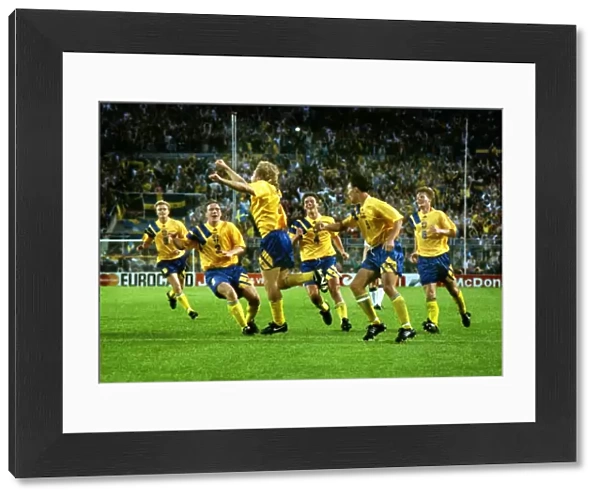 Swedens Tomas Brolin celebrates with his teammates after scoring the winning goal against England at Euro 92