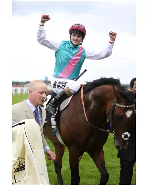 Tom Queally celebrates winning the Queen Anne Stakes on Frankel