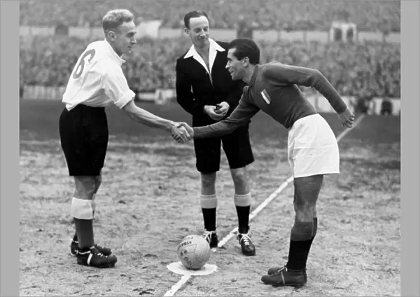 England captain Billy Wright shakes hands with Italy captain Riccardo Carapellese in 1949 +
