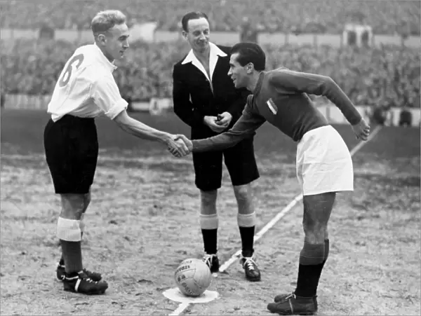 England captain Billy Wright shakes hands with Italy captain Riccardo Carapellese in 1949 +