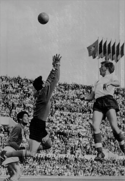 Englands Gerald Hitchens lobs the Italian goalkeeper to score in 1961 +