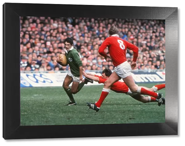 Irelands Michael Bradley makes a break against Wales - 1985 Five Nations