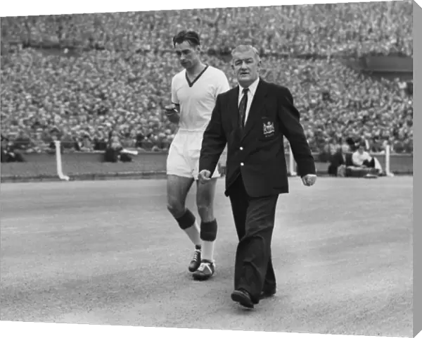 Ray Wood leaves the field injured in the 1957 FA Cup Final