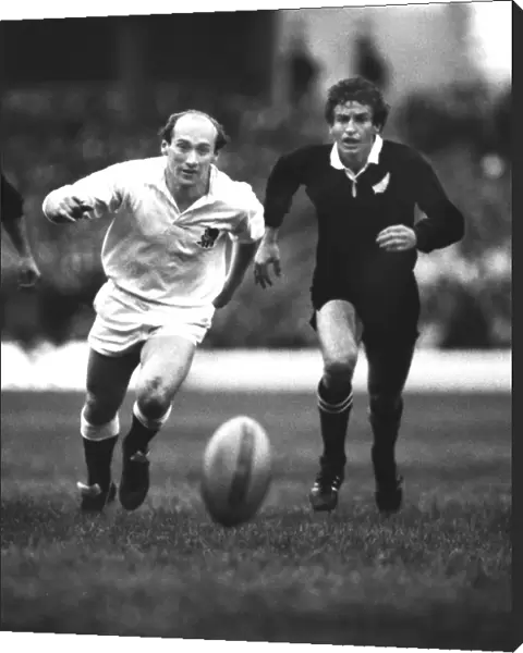 Les Cusworth and Robbie Deans chases after the ball at Twickenham in 1983