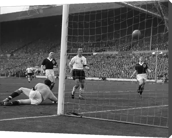 Englands Jimmy Greaves scores against Scotland in 1961