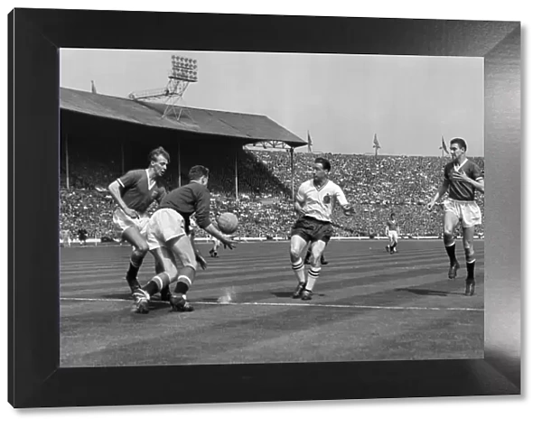 Harry Gregg fields the ball under pressure from Nat Lofthouse in the 1958 FA Cup Final