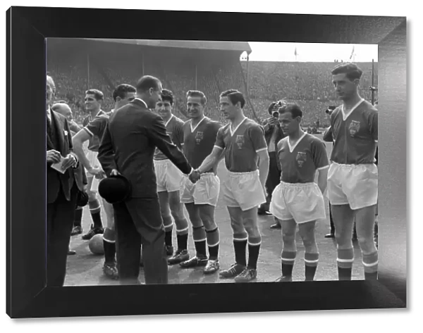 Prince Philip is introduced to the Manchester United players before the 1958 FA Cup Final