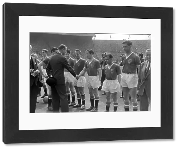 Prince Philip is introduced to the Manchester United players before the 1958 FA Cup Final
