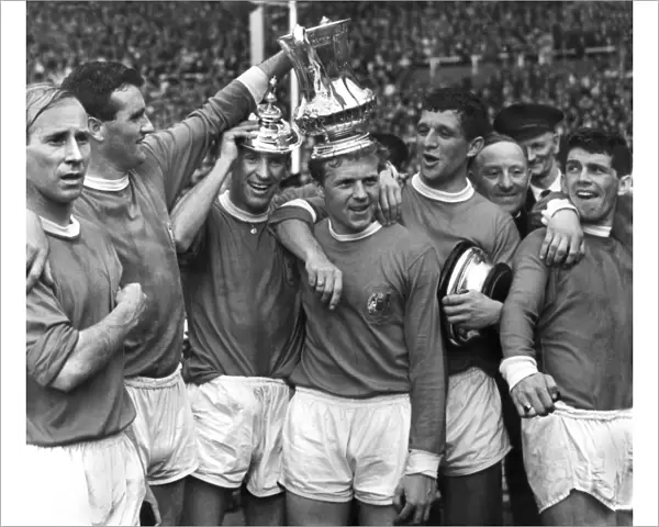 Manchester United players celebrate after winning the FA Cup in 1963
