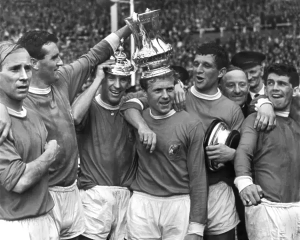Manchester United players celebrate after winning the FA Cup in 1963