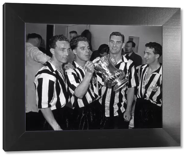 Jackie Milburn and his Newcastle United teammates celebrate their 1955 FA Cup victory