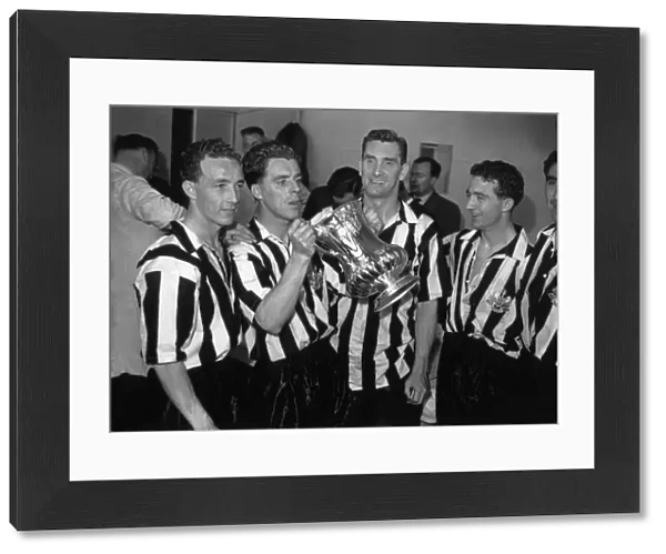 Jackie Milburn and his Newcastle United teammates celebrate their 1955 FA Cup victory