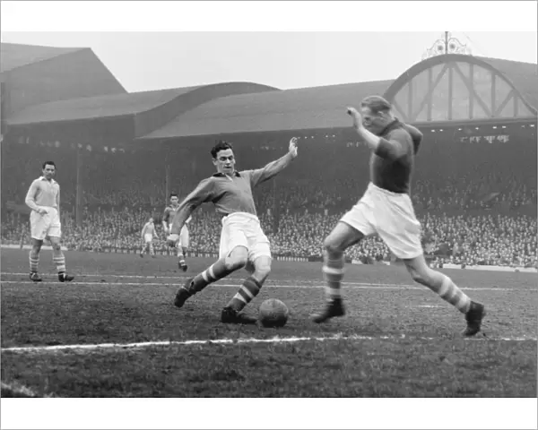 Manchester City goalkeeper closes down Liverpools John Smith at Anfield in 1951  /  2