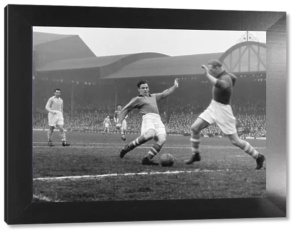 Manchester City goalkeeper closes down Liverpools John Smith at Anfield in 1951  /  2