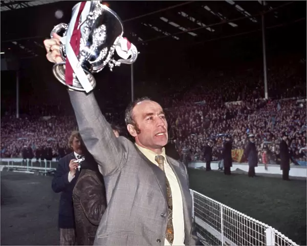Aston Villa manager Ron Saunders displays the League Cup after victory in 1975