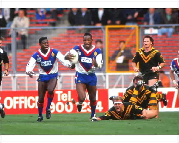 Great Britains Ellery Hanley and Martin Offiah take on Australia