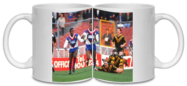 Great Britains Ellery Hanley and Martin Offiah take on Australia