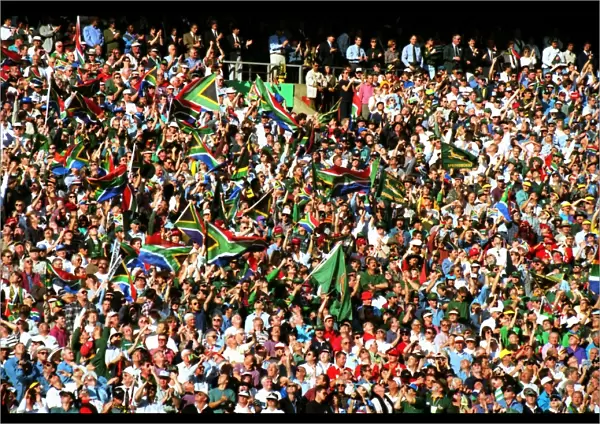 Fans wave the South African flag in the stands at Ellis Park during the 1995 Rugby World Cup Final
