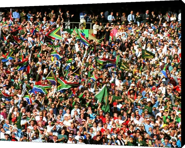 Fans wave the South African flag in the stands at Ellis Park during the 1995 Rugby World Cup Final
