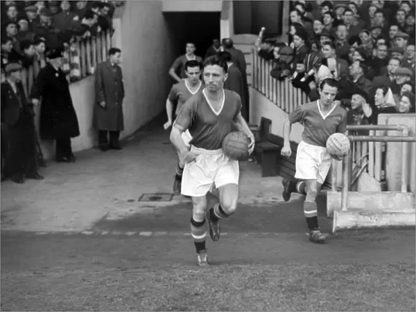 Roger Byrne leads Manchester United out at Old Trafford in 1955