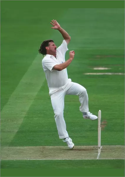 Ian Botham bowls for England in 1992