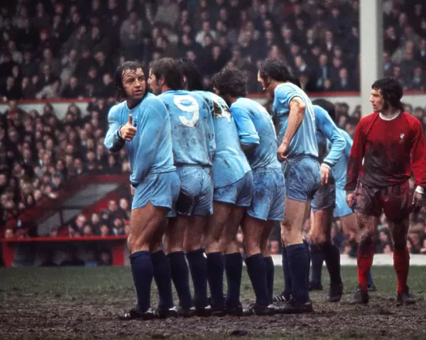 Coventrys Ernie Hunts checks his position in the wall during a game at Anfield in 1971  /  2