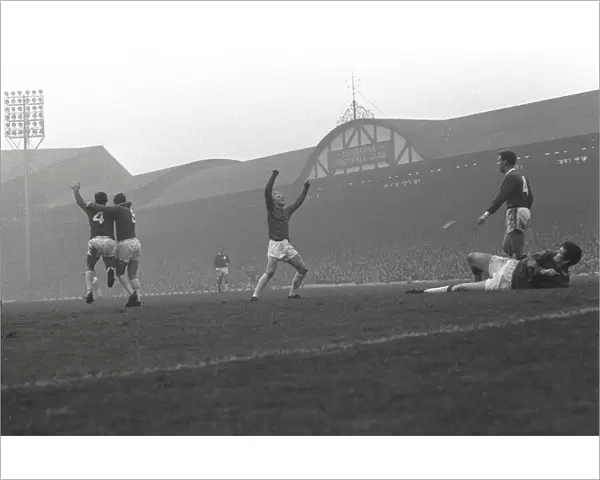 Manchester United players celebrate Paddy Crerands goal at Anfield in 1964