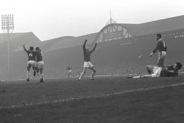 Manchester United players celebrate Paddy Crerands goal at Anfield in 1964