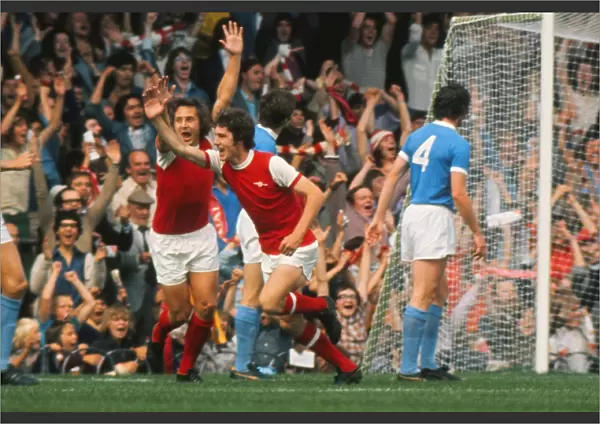 Arsenals Brian Kidd celebrates a goal in front of the North Bank