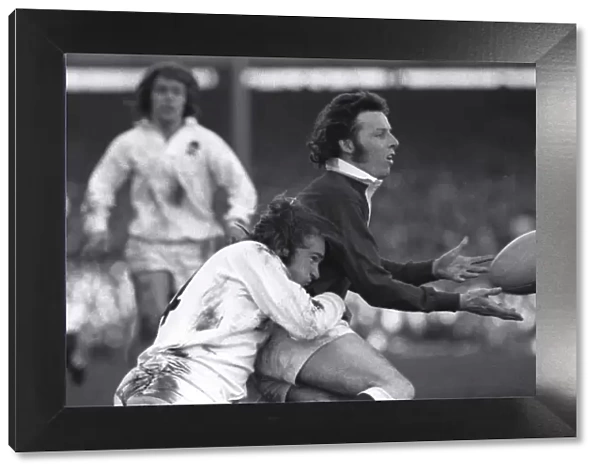 Wales JJ Williams is tackled by Englands Peter Squires - 1974 Five Nations