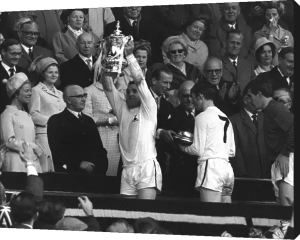 Spurs captain Dave Mackay lifts the FA Cup in 1967