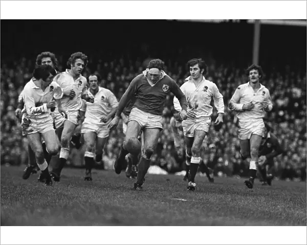 Irelands Willie John McBride kicks ahead against England - 1974 Five Nations