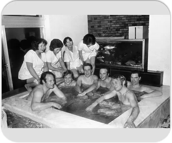 The 1972 Great Britain Olympic luge team relax in a bathouse in Sapporo, Japan