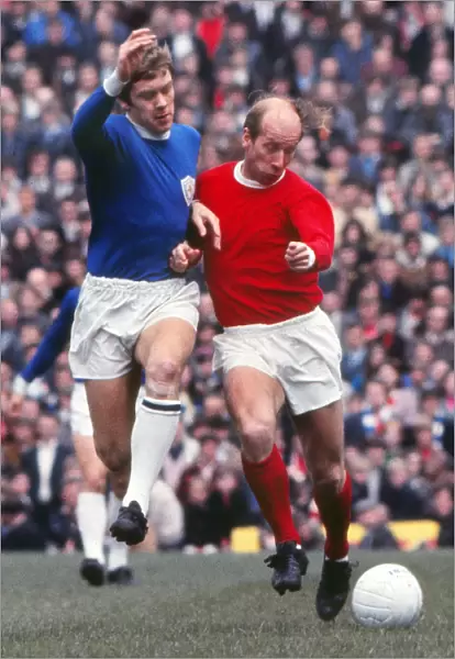 Bobby Charlton and David Nish compete for the ball in 1969
