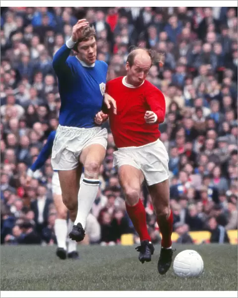 Bobby Charlton and David Nish compete for the ball in 1969
