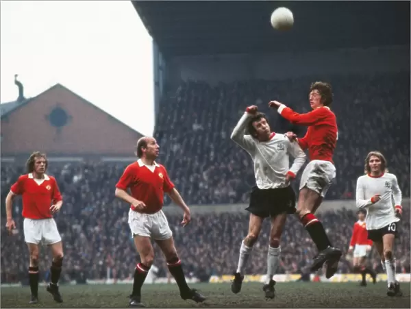 Arnie Sidebottom and Bill Dearden jump for the ball at Old Trafford in 1973