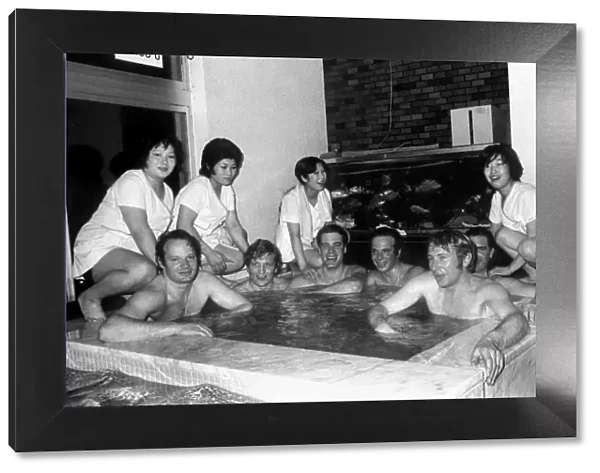 The 1972 Great Britain Olympic luge team relax in a bathouse in Sapporo, Japan