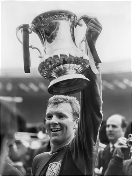 West Ham captain Bobby Moore lifts the FA Cup in 1964