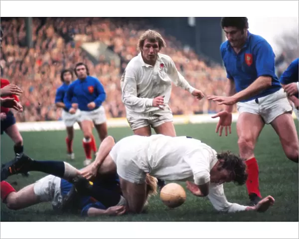 Englands Andy Ripley goes to ground with John Watkins in support - 1975 Five Nations