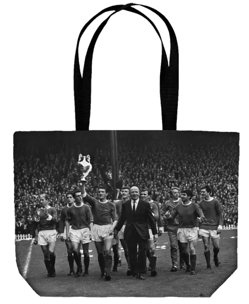 The Manchester United team do a lap of honour with manager Matt Busby after winning the league title in 1967