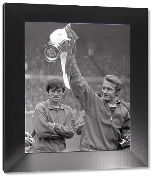 George Best and Denis Law, with the league championship trophy, in 1967
