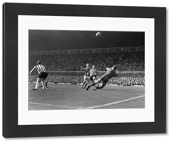 Manchester Uniteds Denis Law takes on Newcastle in 1966
