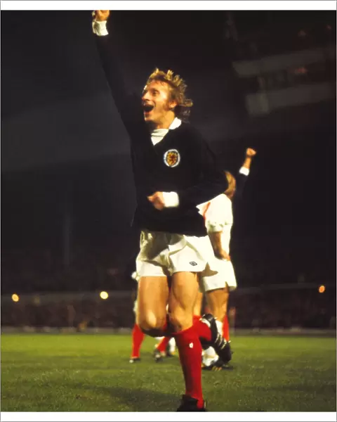 Scotlands Denis Law celebrates qualification for the 1974 World Cup