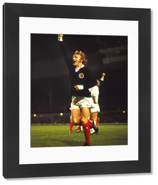 Scotlands Denis Law celebrates qualification for the 1974 World Cup