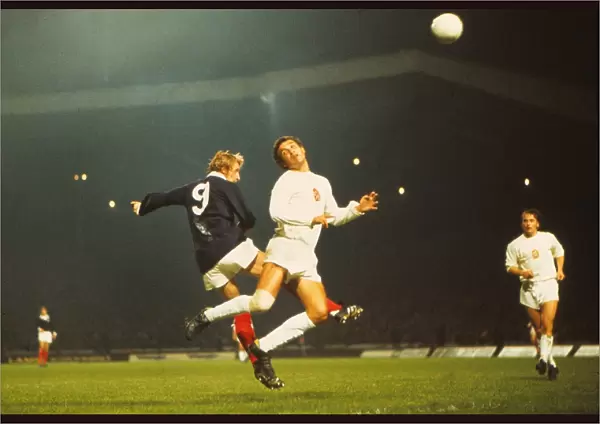 Denis Law jumps for a header during the game that gave Scotland qualification for the 1974 World Cup