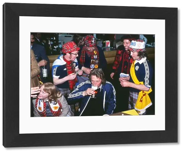 Denis Law has a drink with Scottish fans at the 1978 World Cup